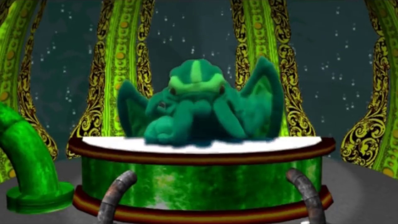 Still from Calls for Cthulhu: a green puppet Cthulhu sits behind a desk